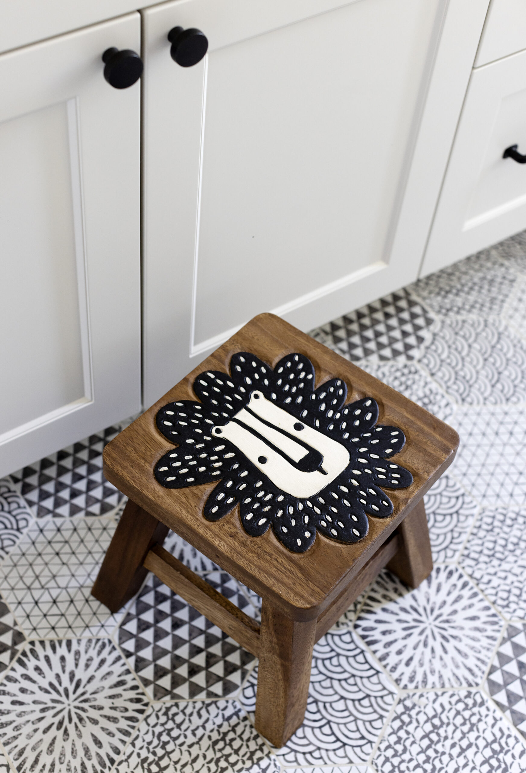 small wooden stool in Grand Boulevard House